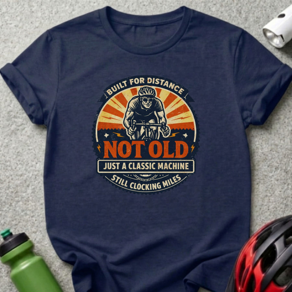 Navy t-shirt with "Built for distance, not old, just a classic machine, still clocking miles" text.