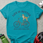 Turquoise t-shirt with "Life is Better With a Bike and a Dog" text and illustration.