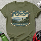 Olive t-shirt with oval graphic: mountain biker on hill, text "IT LOOKED FLAT ON THE MAP" and "Somewhere on the Blue Ridge".