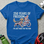 Blue t-shirt with cyclist, dog, and "250 Years of Freedom" text.
