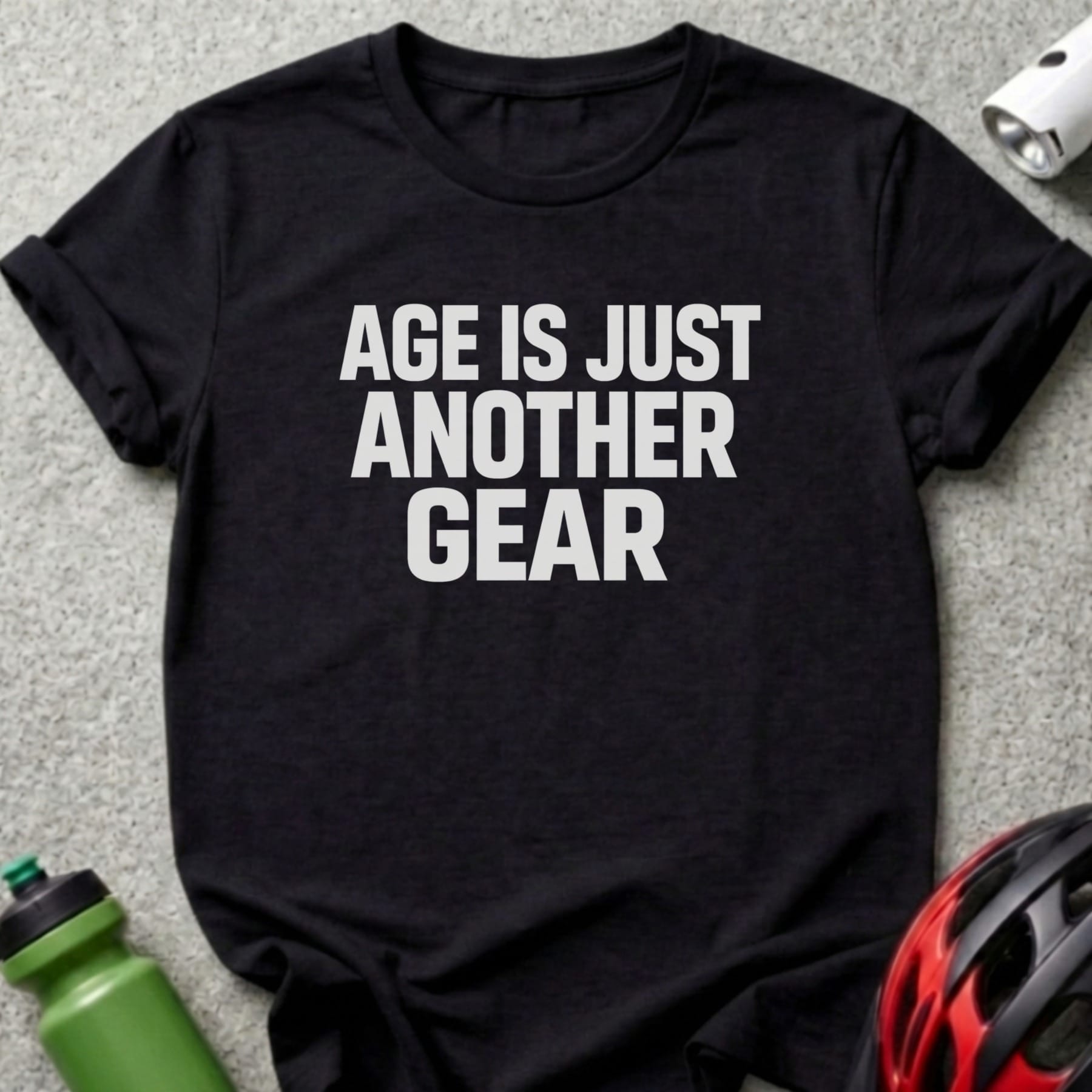 Black t-shirt with white text "AGE IS JUST ANOTHER GEAR".