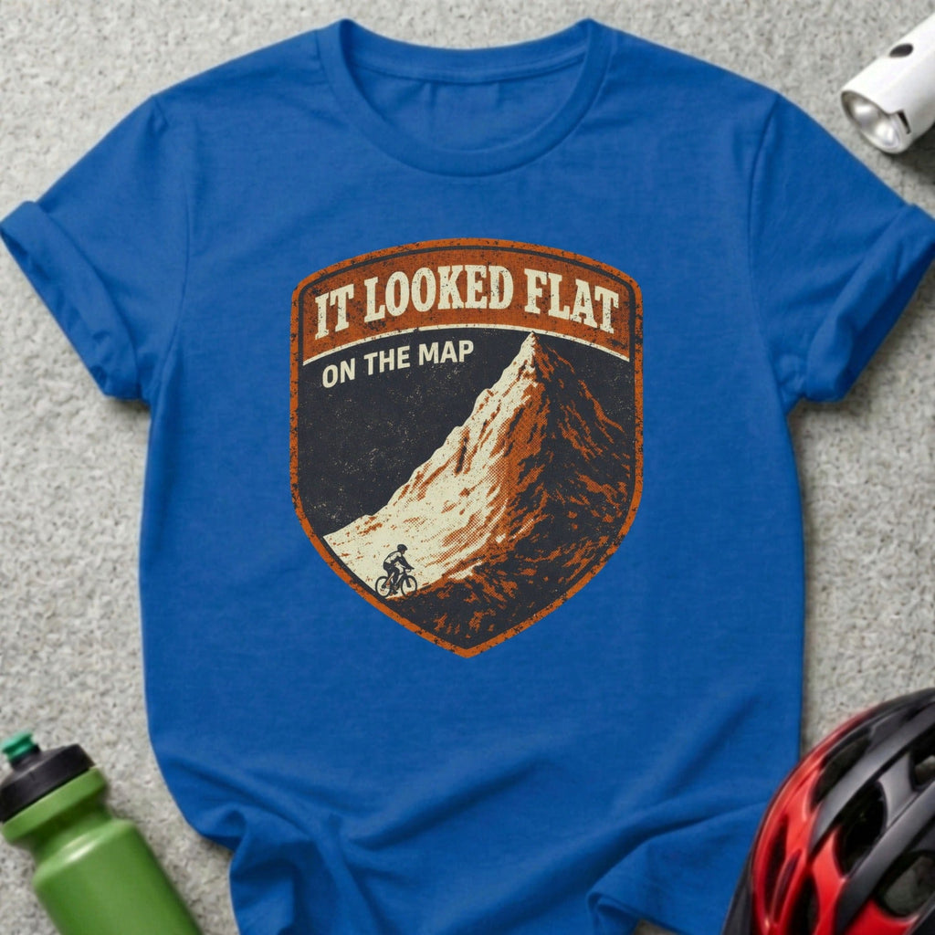 Blue t-shirt with a shield logo featuring a mountain and a cyclist.