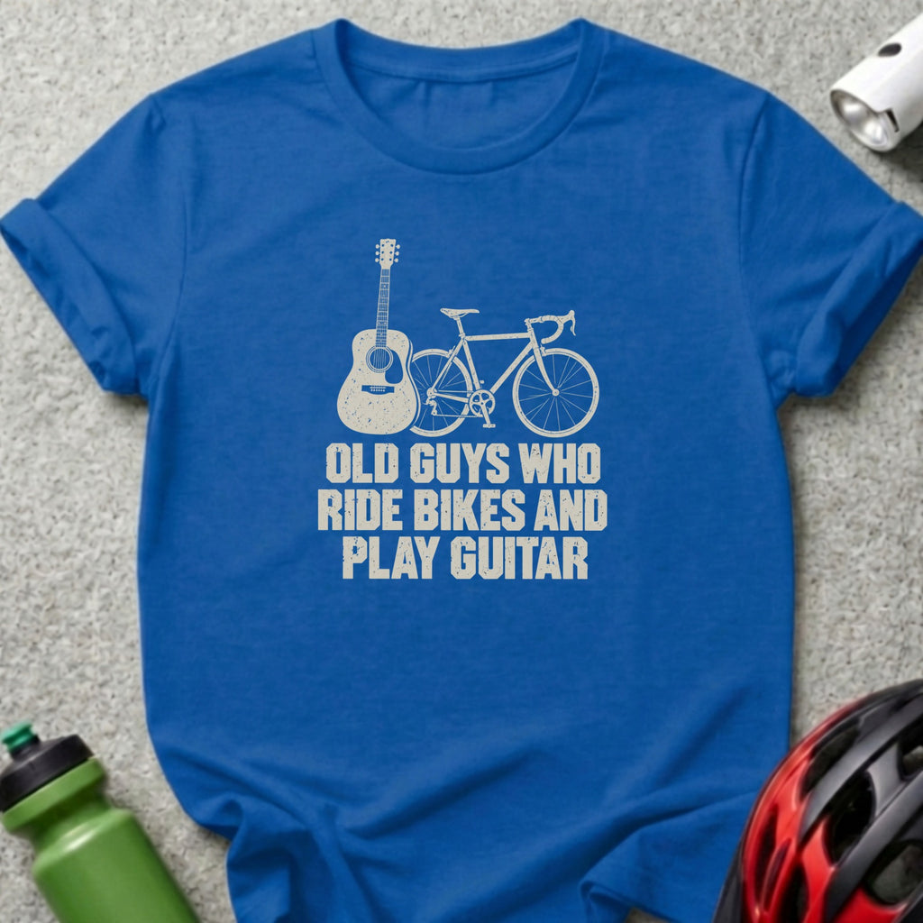 A blue t-shirt printed with a bicycle, guitar, and the text Old Guys Who Ride Bikes and Play Guitar.