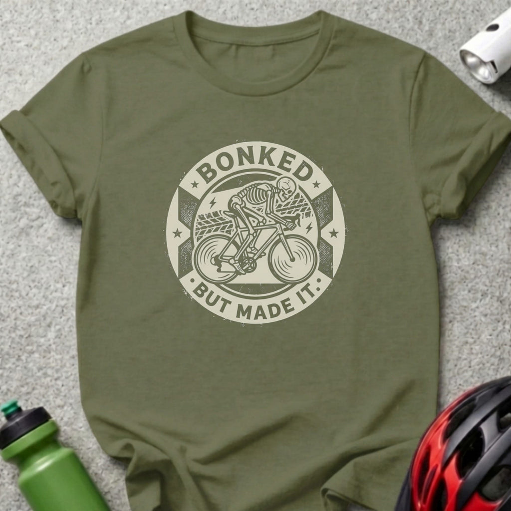 T-shirt with circular graphic of a skeleton cycling, "Bonked But Made It" text.