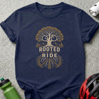 Navy t-shirt with a graphic of a tree and the text "ROOTED IN THE RIDE."