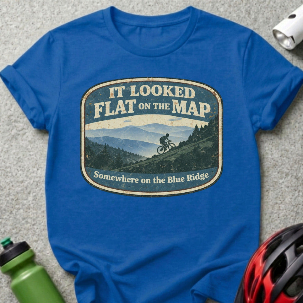 Blue t-shirt with "It looked flat on the map" mountain bike graphic.