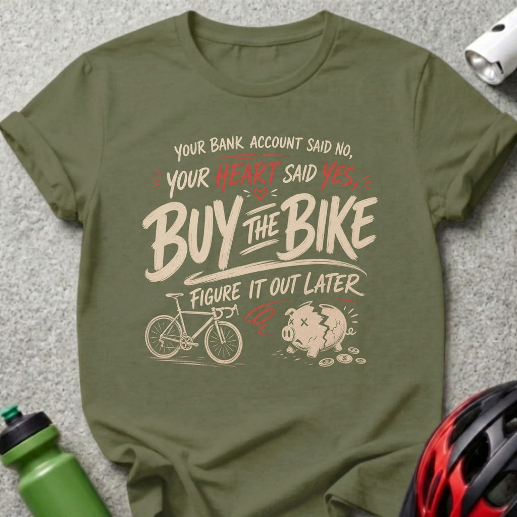 Olive green t-shirt with "Your bank account said no, your heart said yes, buy the bike" and a piggy bank.