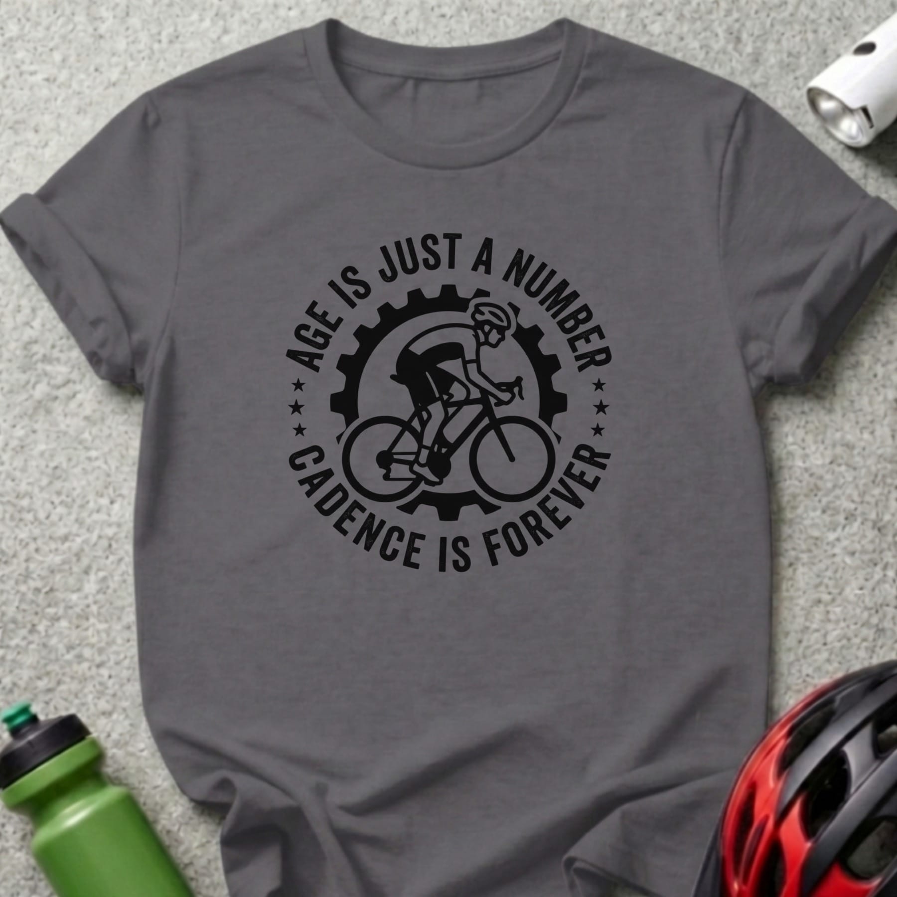Gray t-shirt with "Age is just a number, cadence is forever" cyclist graphic.