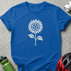 A royal blue t-shirt featuring a white graphic of a sunflower with bicycle gear details.