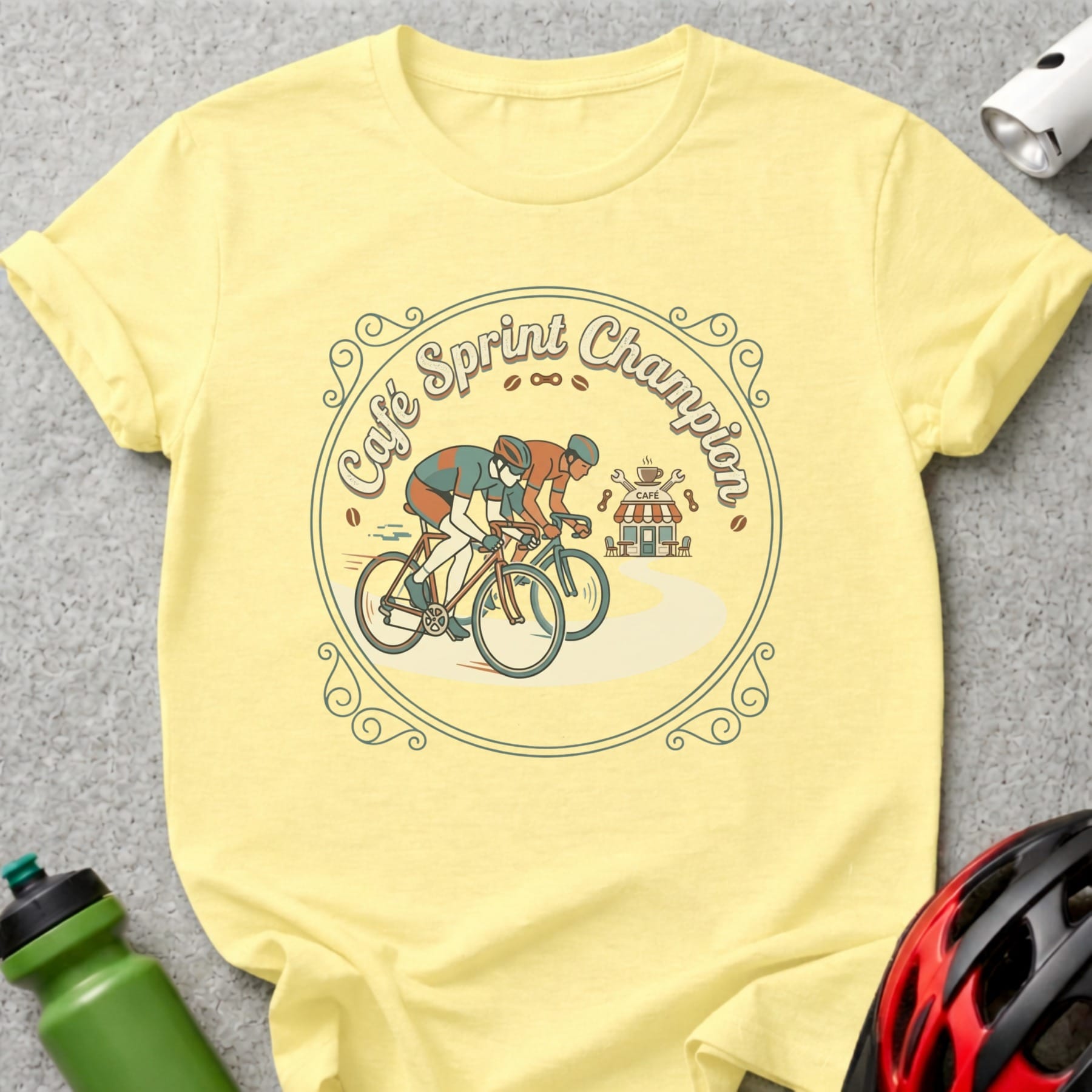 Yellow t-shirt featuring cyclists racing past a cafe, with "Café Sprint Champion" text.