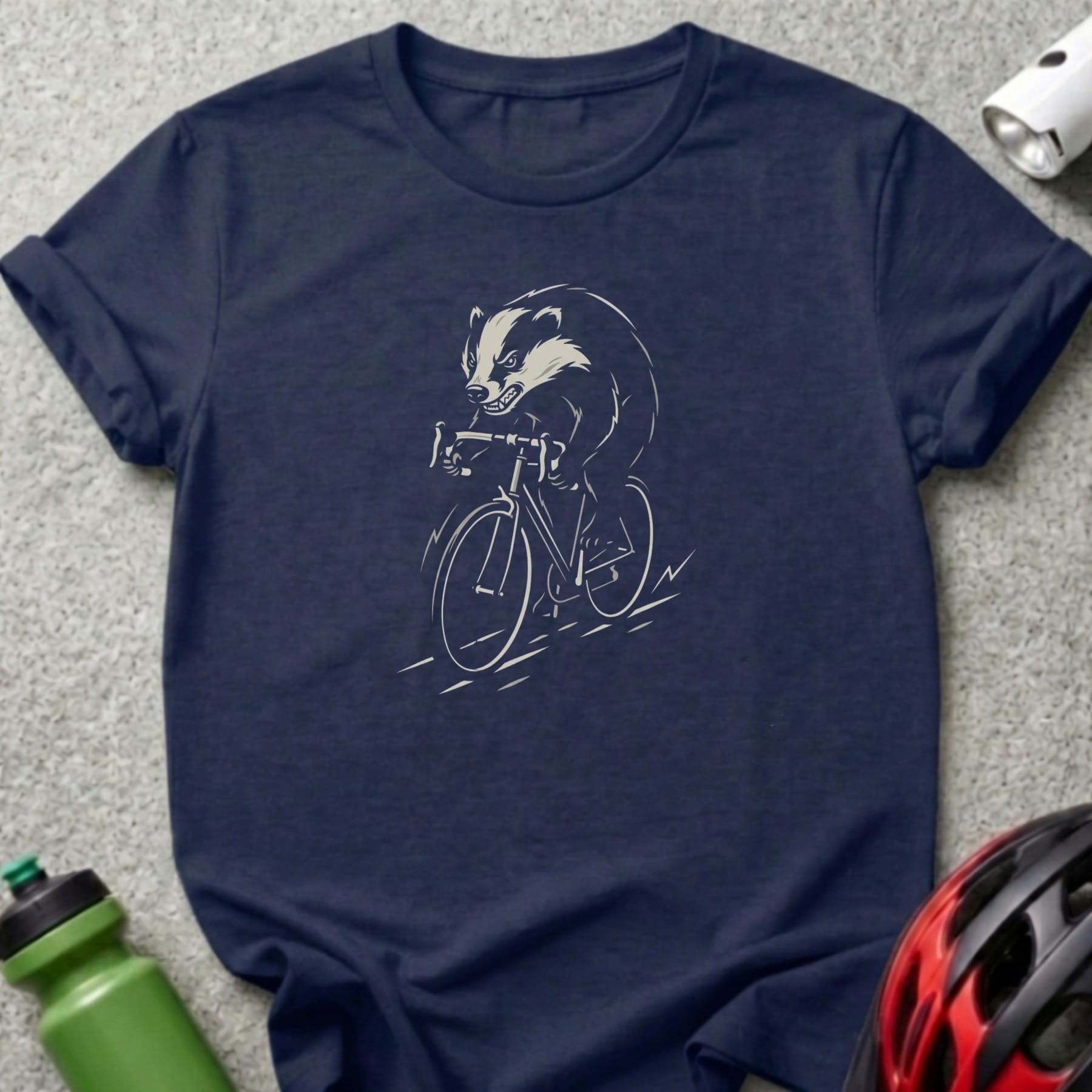 Navy t-shirt with a graphic of a badger riding a bicycle.