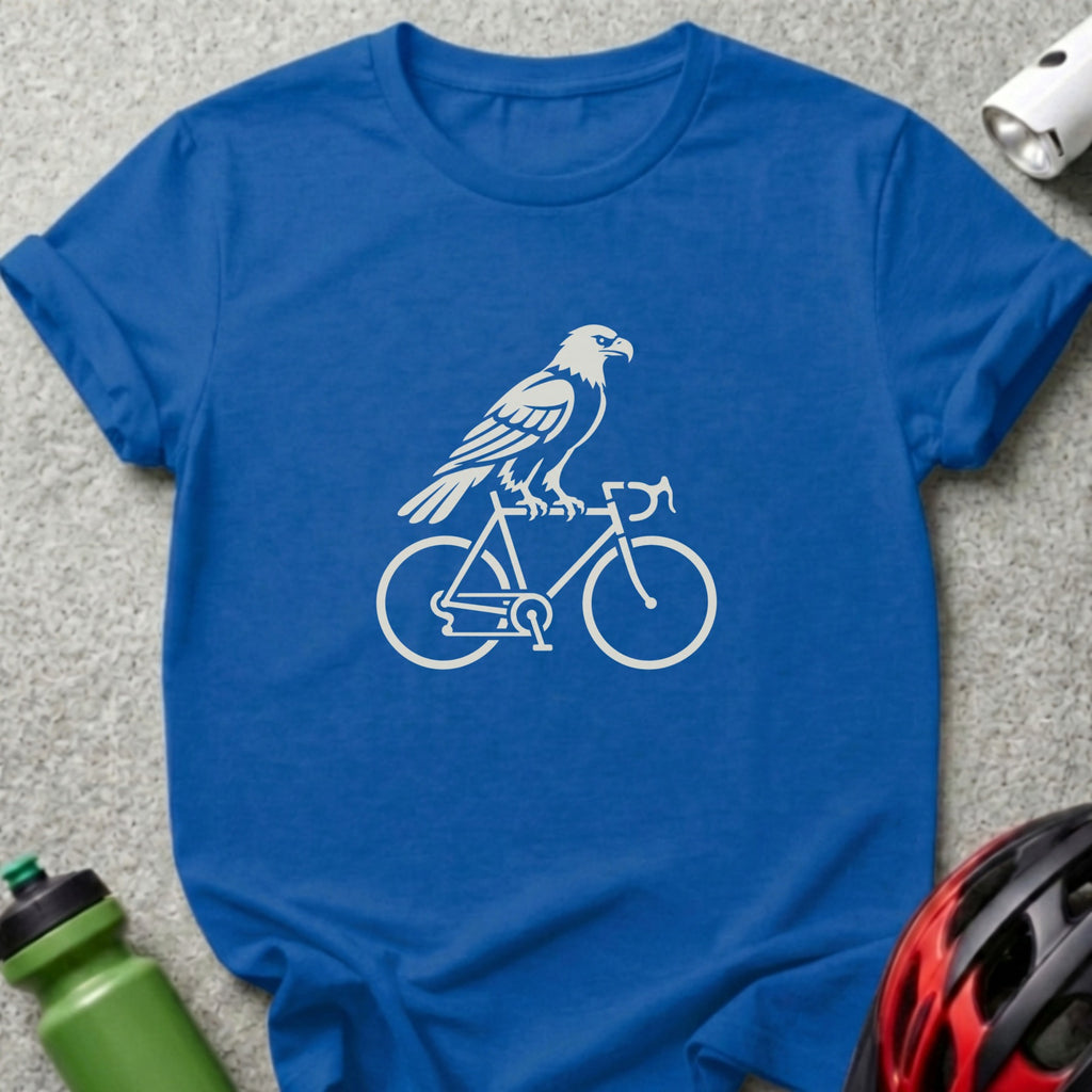 A blue t-shirt features a white graphic of an eagle perched on a bicycle frame.