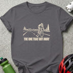 Dark gray t-shirt featuring a cream graphic of cyclists on a road and text reading THE ONE THAT GOT AWAY.