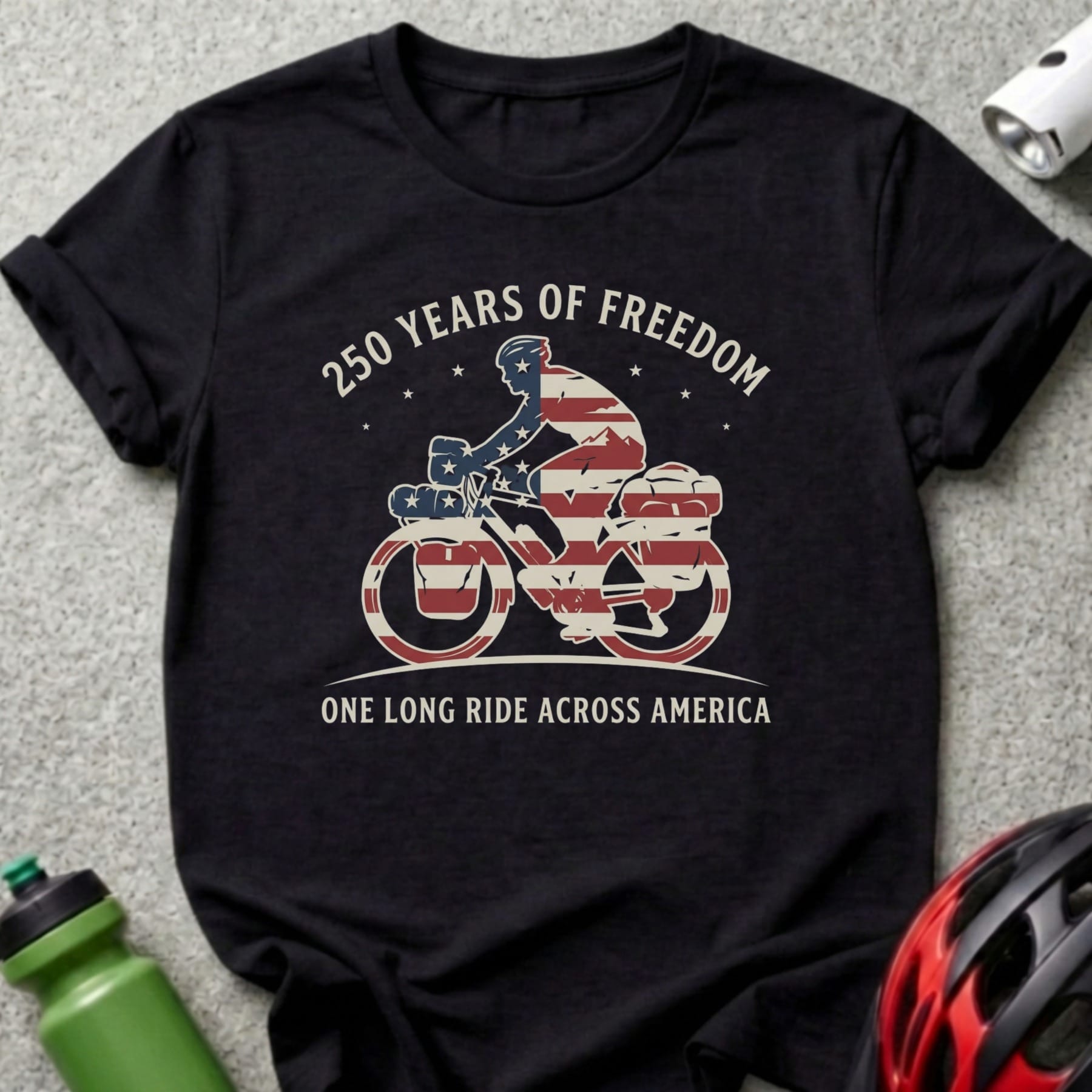 Black t-shirt with "250 Years of Freedom One Long Ride Across America" text and bicycle graphic.