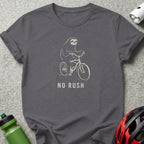 Gray t-shirt with a sloth riding a bicycle and the text "NO RUSH".