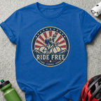 Blue t-shirt with "Ride Free" graphic featuring a cyclist and patriotic elements.