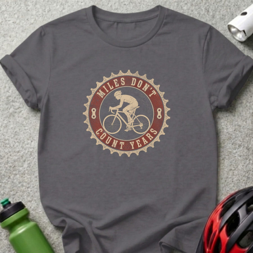 Dark gray t-shirt with a circular vintage cycling graphic that says "Miles Don't Count Years".