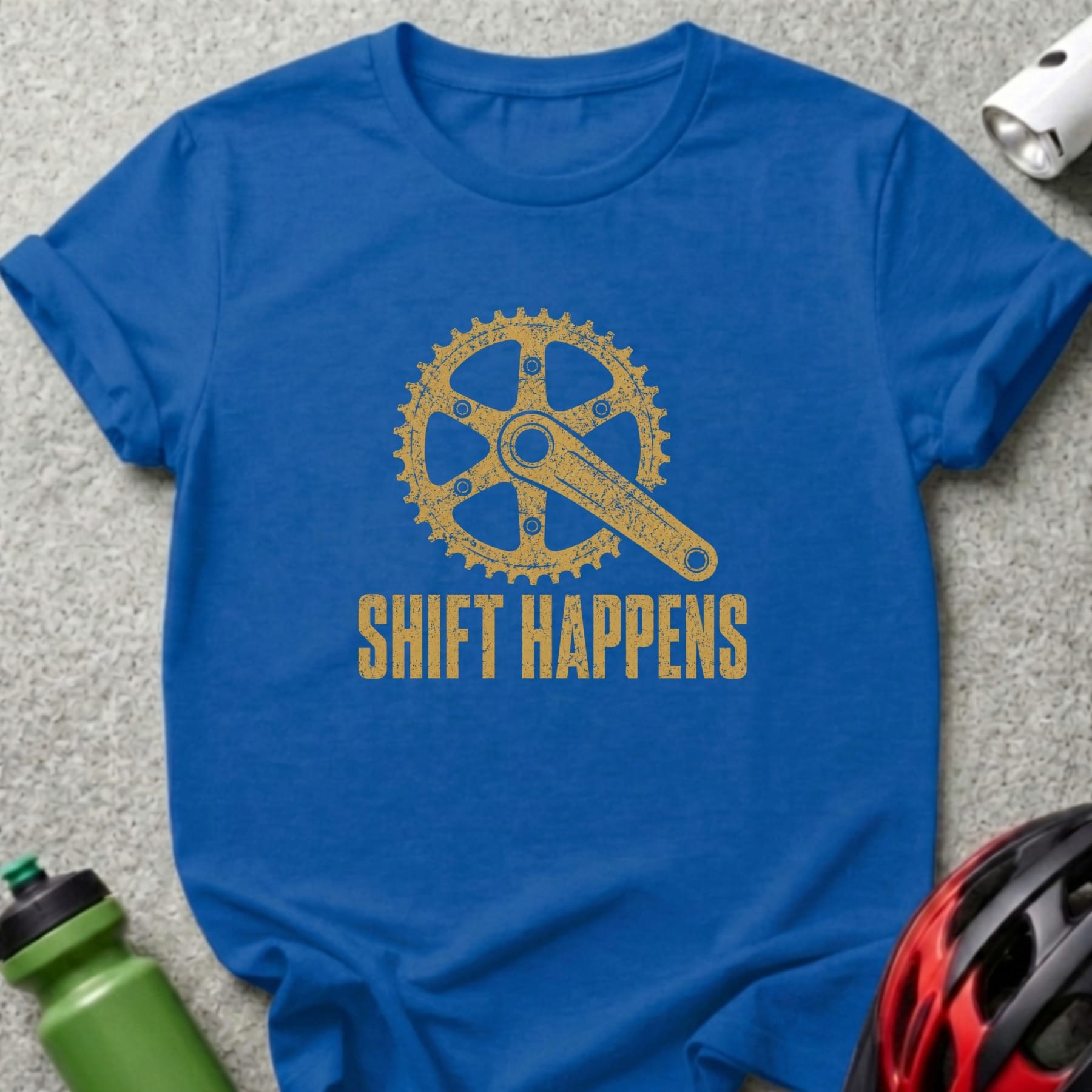 Blue t-shirt with gold bicycle crankset graphic and text "SHIFT HAPPENS".