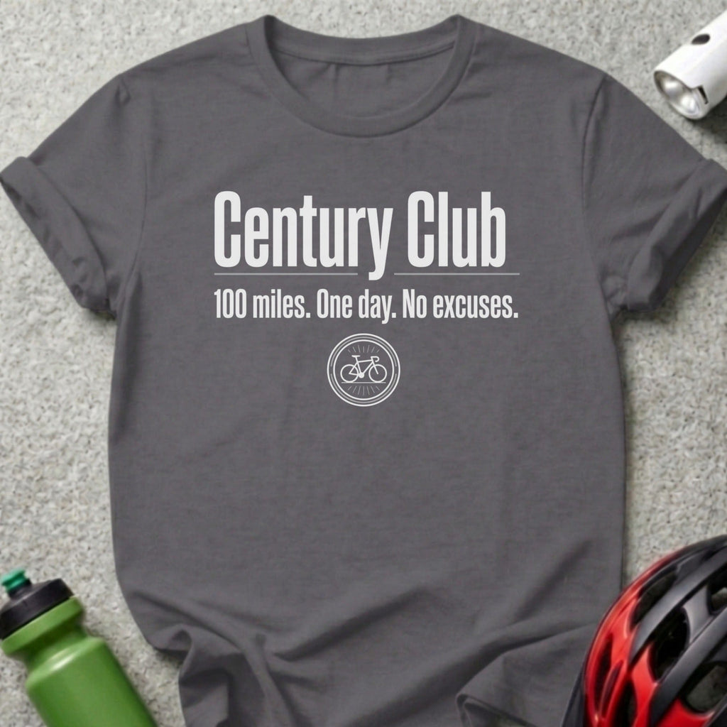 Dark grey t-shirt with "Century Club 100 miles. One day. No excuses." text and bicycle graphic.