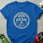 Blue t-shirt with "Age is a gear. Use it." text and cyclist graphic.
