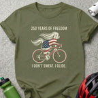 Dog wearing American flag cycling outfit with text "250 YEARS OF FREEDOM" and "I DON'T SWEAT. I GLIDE."