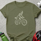 Lincoln riding a bicycle, wearing a top hat and coat.