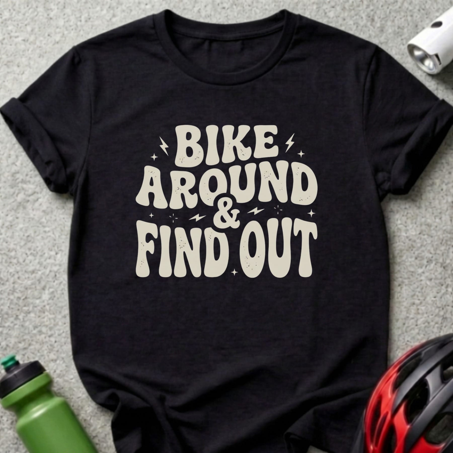 Black t-shirt with "BIKE AROUND & FIND OUT" text in retro font.