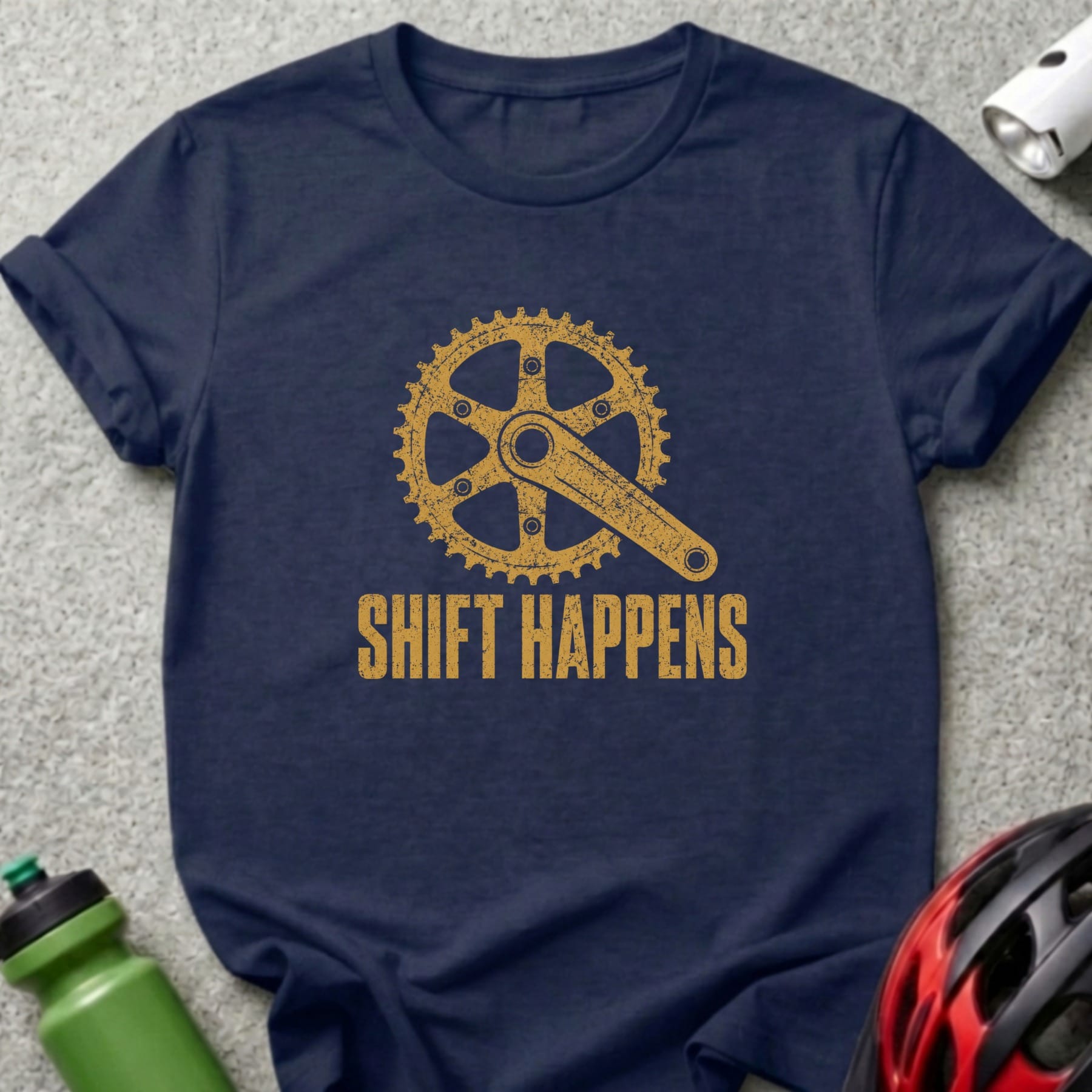 Navy t-shirt with gold bicycle crank and "SHIFT HAPPENS" text.
