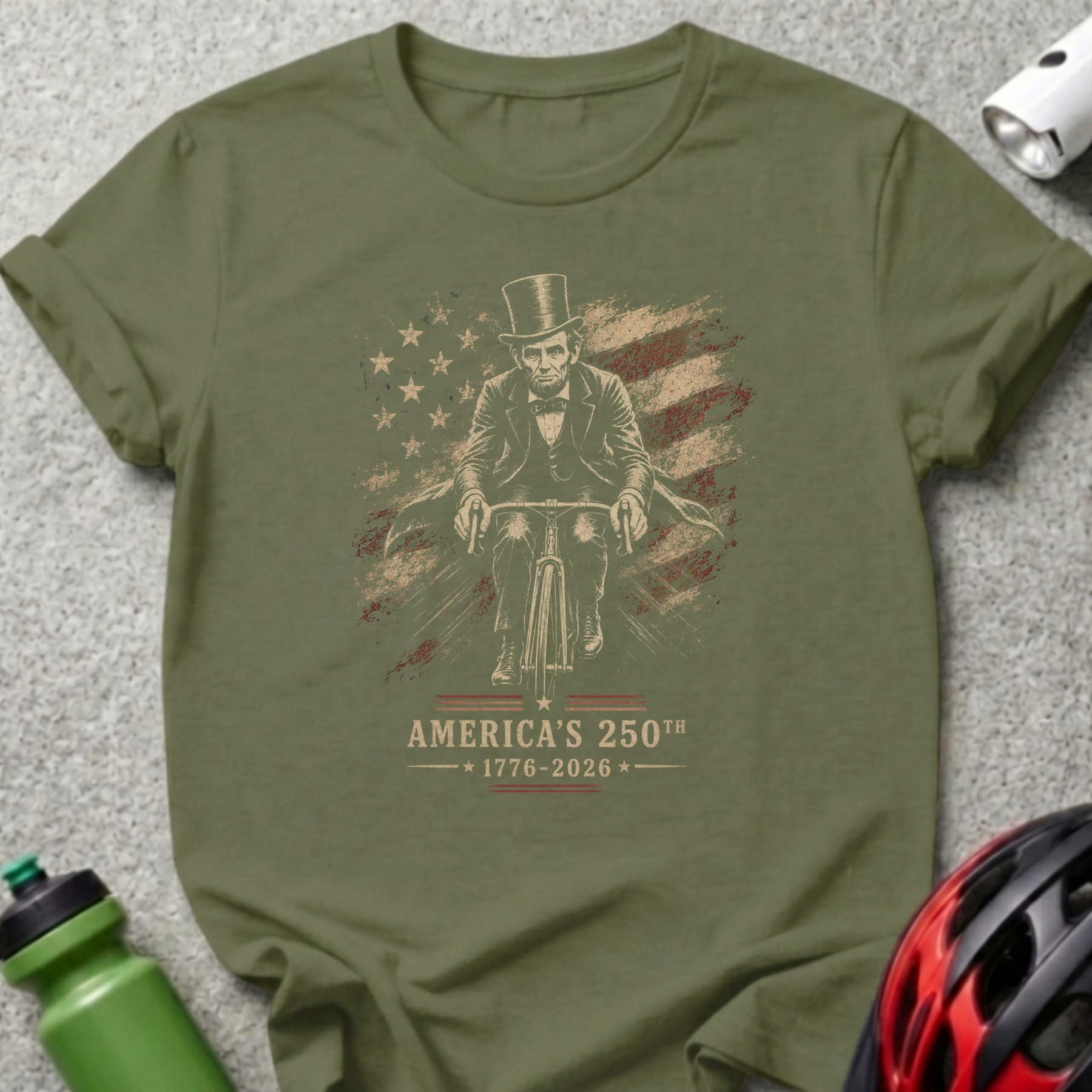 Abraham Lincoln on bicycle with American flag, "America's 250th" text.