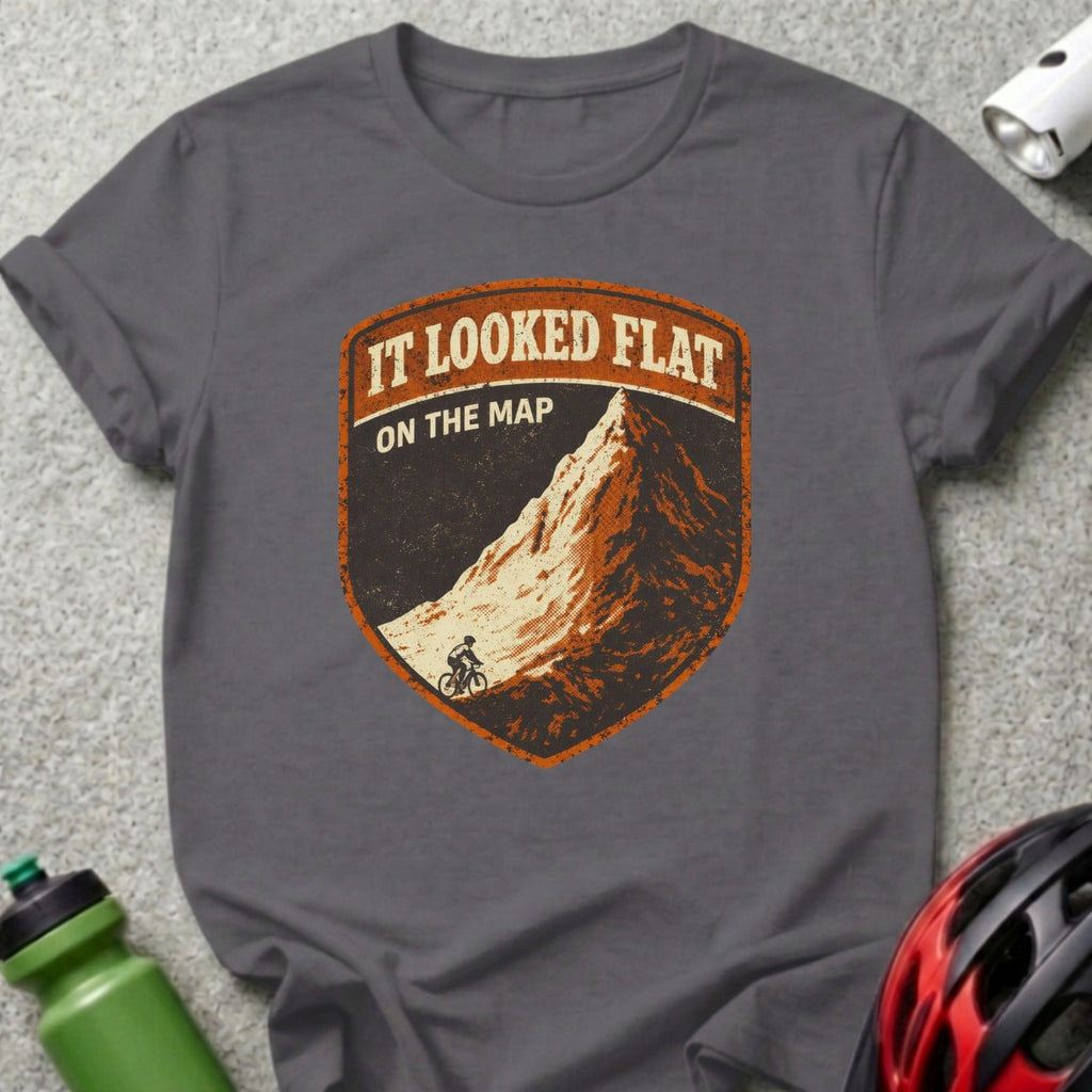 Dark grey t-shirt with a distressed shield logo featuring a mountain and cyclist.