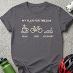 Dark gray t-shirt with white graphic: coffee cup, bicycle, sleeping person.