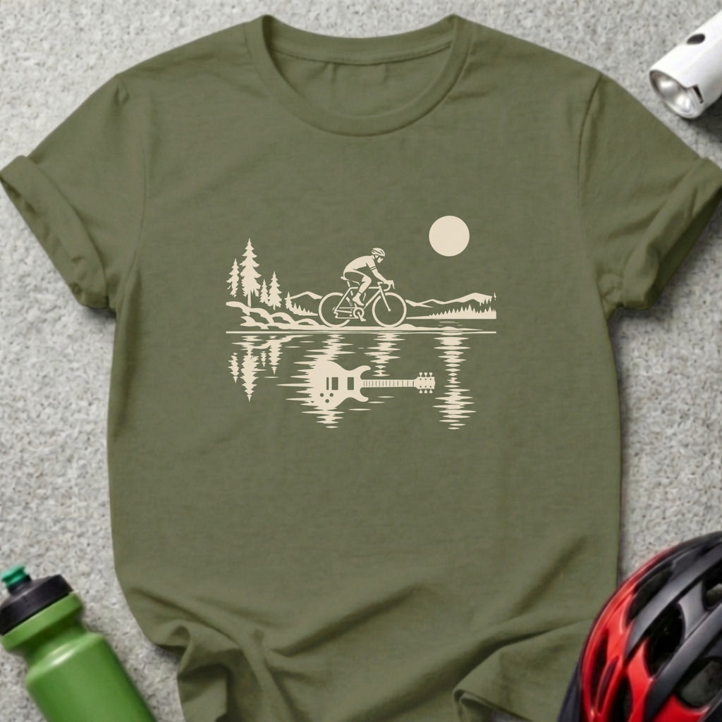 An olive green crewneck t-shirt featuring a surrealist graphic of a cyclist transforming into a guitar reflection on water.