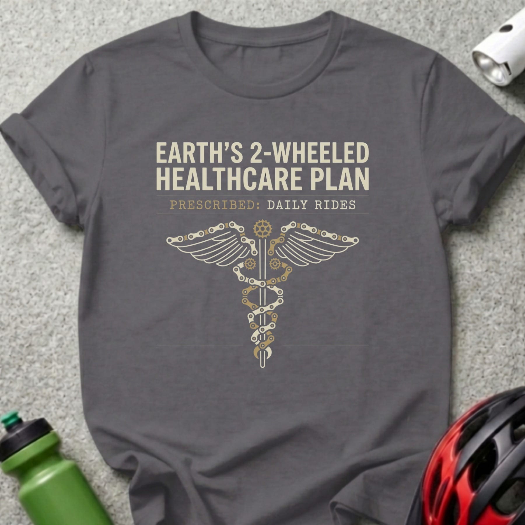 Grey t-shirt with Earth's 2-wheeled healthcare plan prescribed daily rides and caduceus graphic.