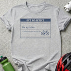 Gray t-shirt with "OUT OF OFFICE" and bicycle graphic.