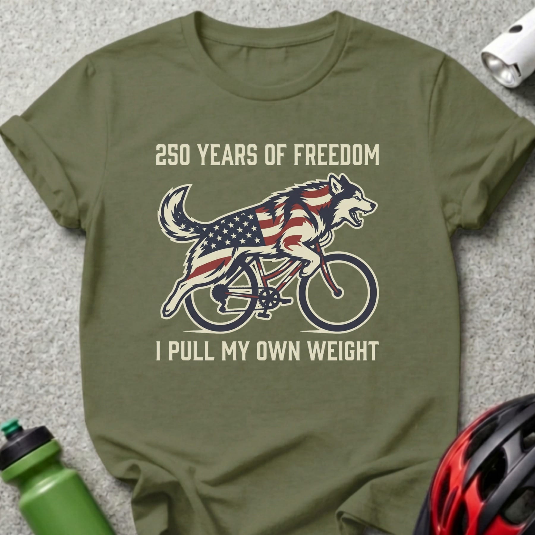 Military green t-shirt with a husky riding a bicycle with American flag overlay.
