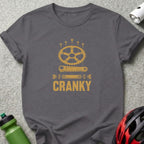 Gray t-shirt with distressed gold graphic of bicycle crank components and the word CRANKY.
