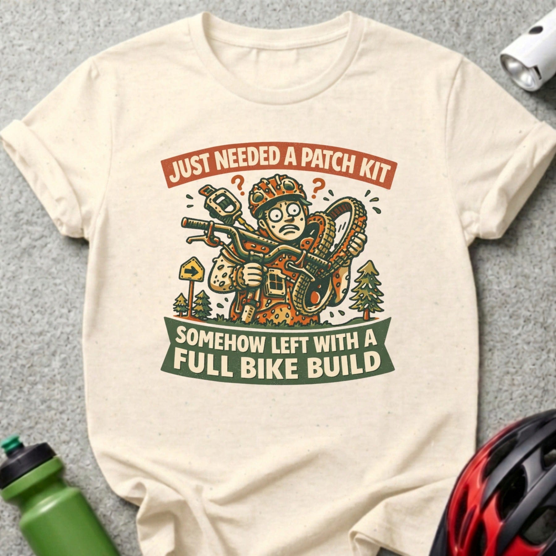 T-shirt graphic of cyclist with tools and a full bike build.