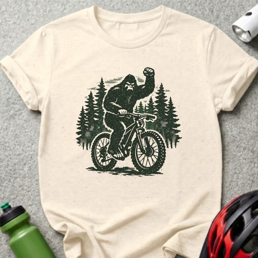 Bigfoot riding a bicycle through a forest.