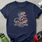 Navy t-shirt with cyclist graphic and "250 Years Strong 1776-2026" text.