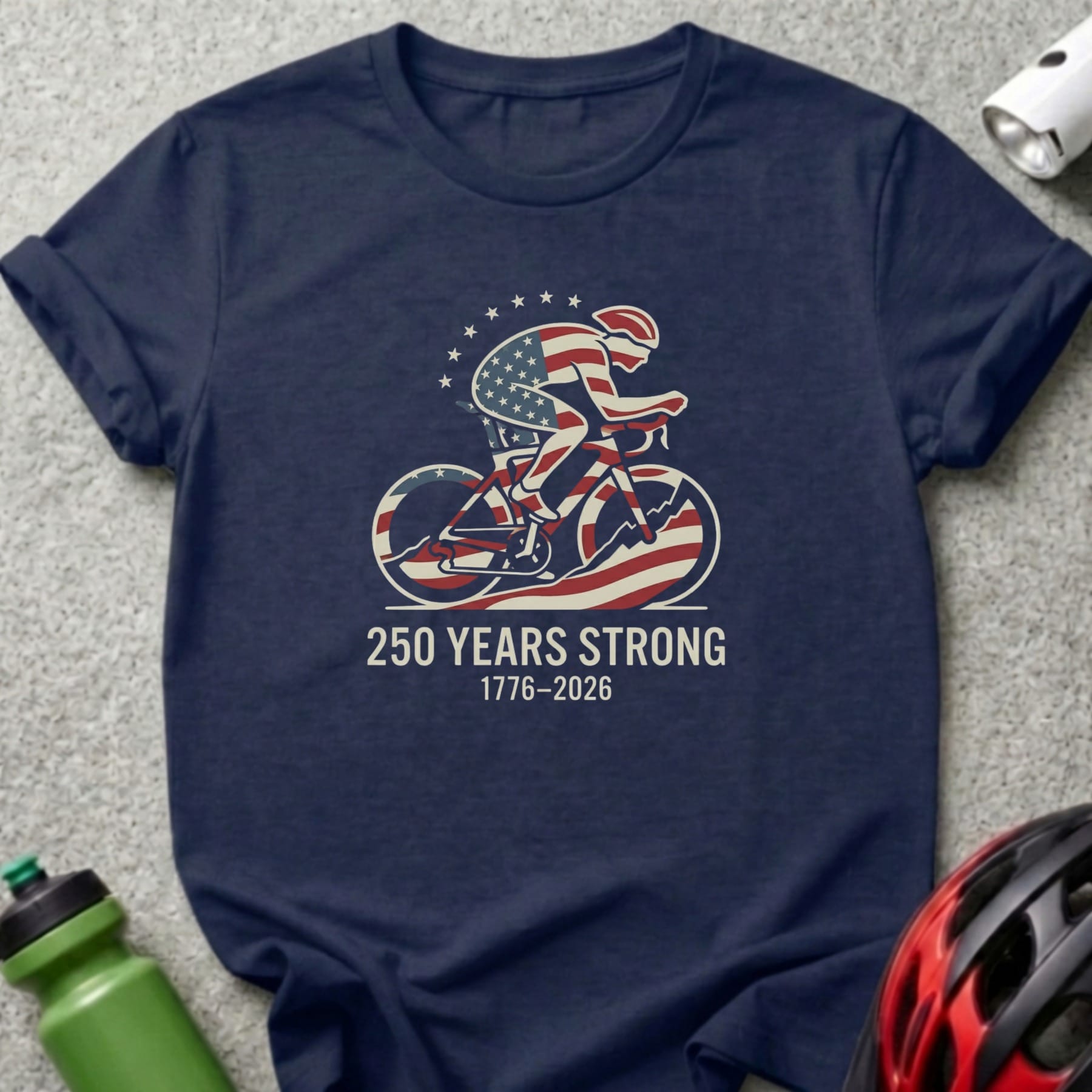 Navy t-shirt with cyclist graphic and "250 Years Strong 1776-2026" text.