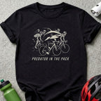 Black t-shirt with "Predator in the Pack" text and a shark on a bicycle.