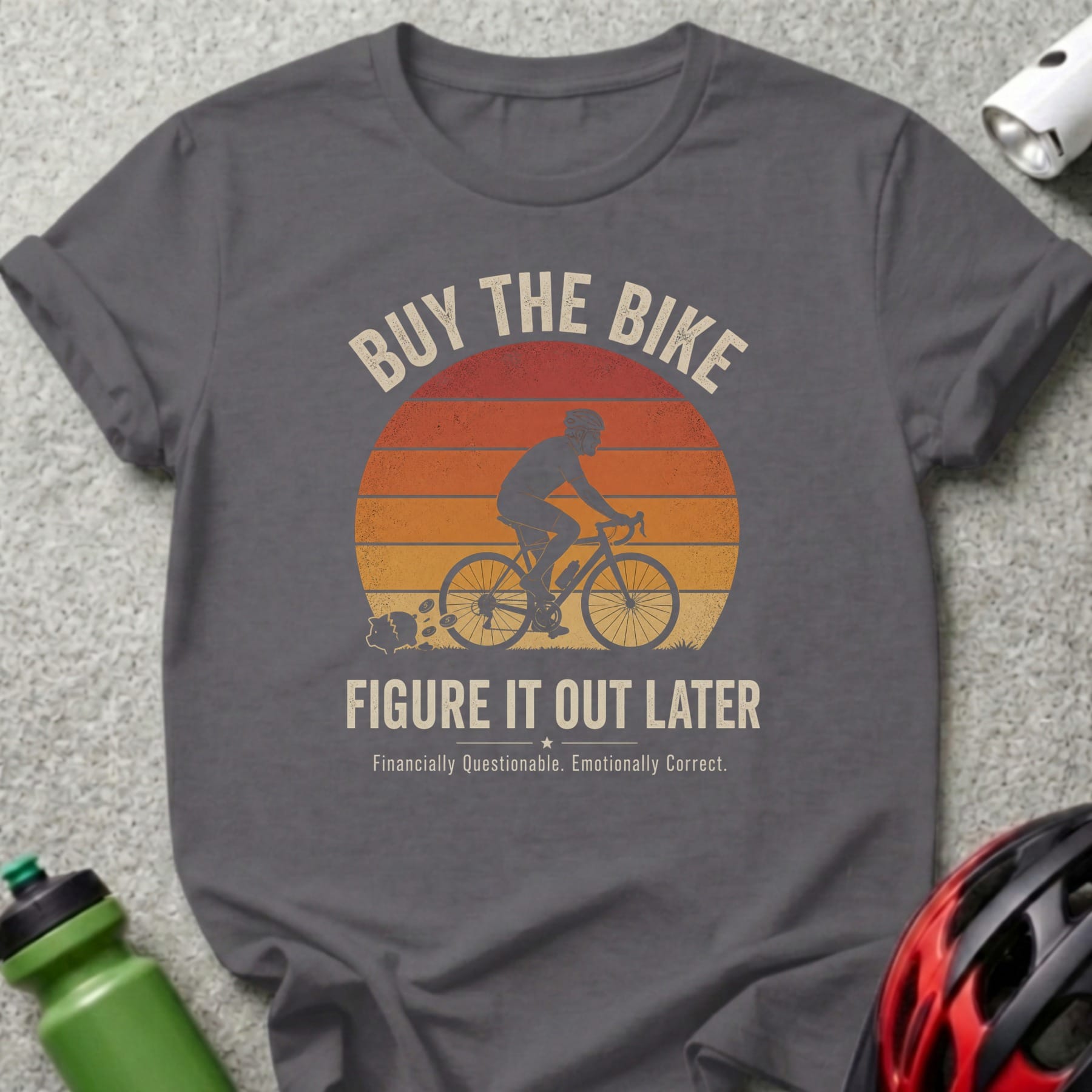 Dark grey t-shirt with "Buy the Bike, Figure it Out Later" text and cyclist graphic.