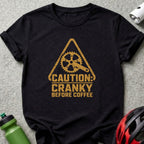 Black t-shirt with distressed graphic: "CAUTION: CRANKY BEFORE COFFEE" and bike crank.