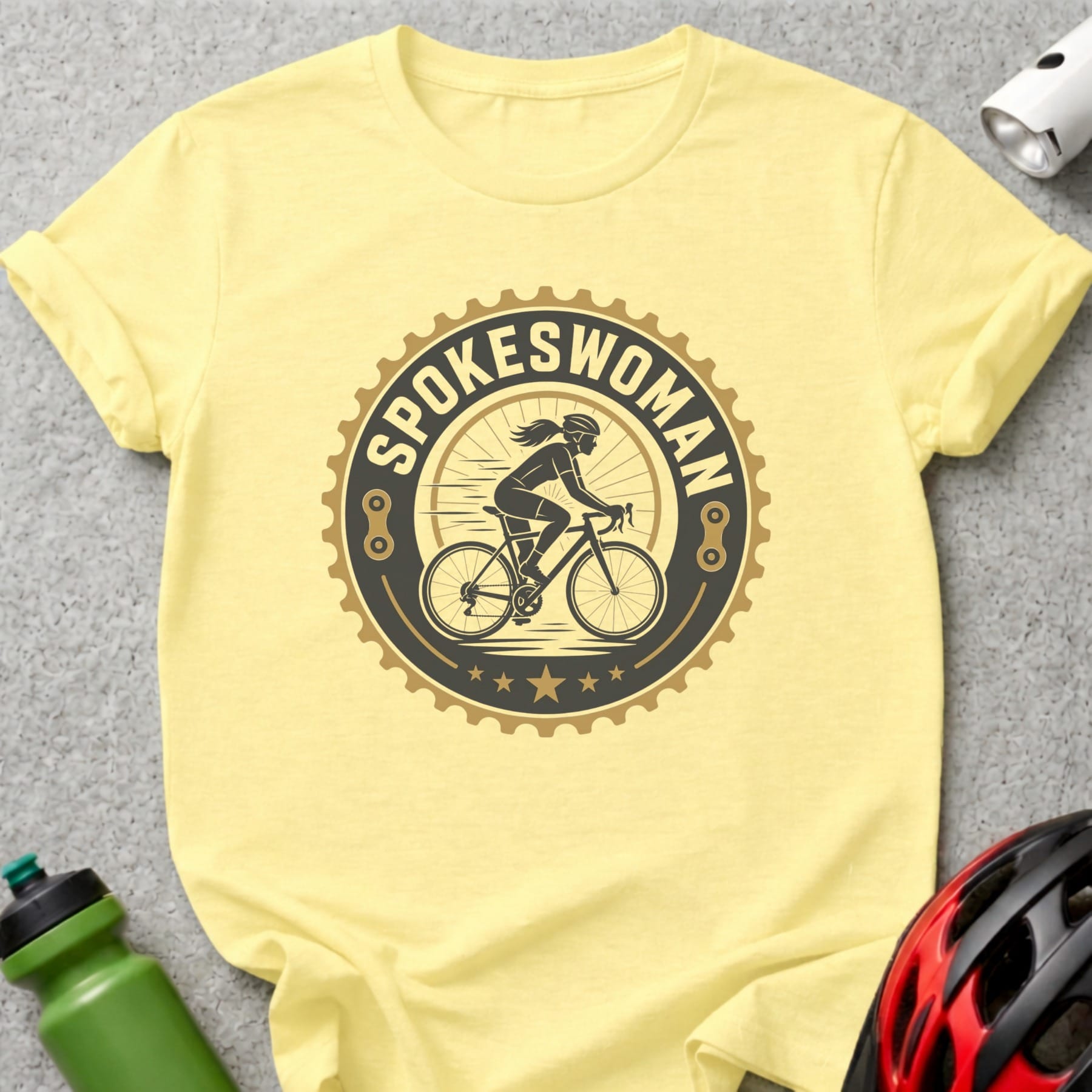 Yellow t-shirt with "Spokeswoman" logo featuring a cyclist silhouette.