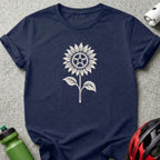 A dark blue crewneck t-shirt featuring a white graphic of a sunflower with a bicycle chainring center.