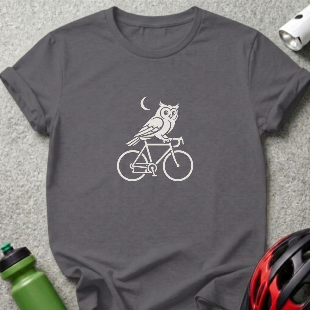Dark grey t-shirt with a white graphic of an owl on a bicycle under a crescent moon.