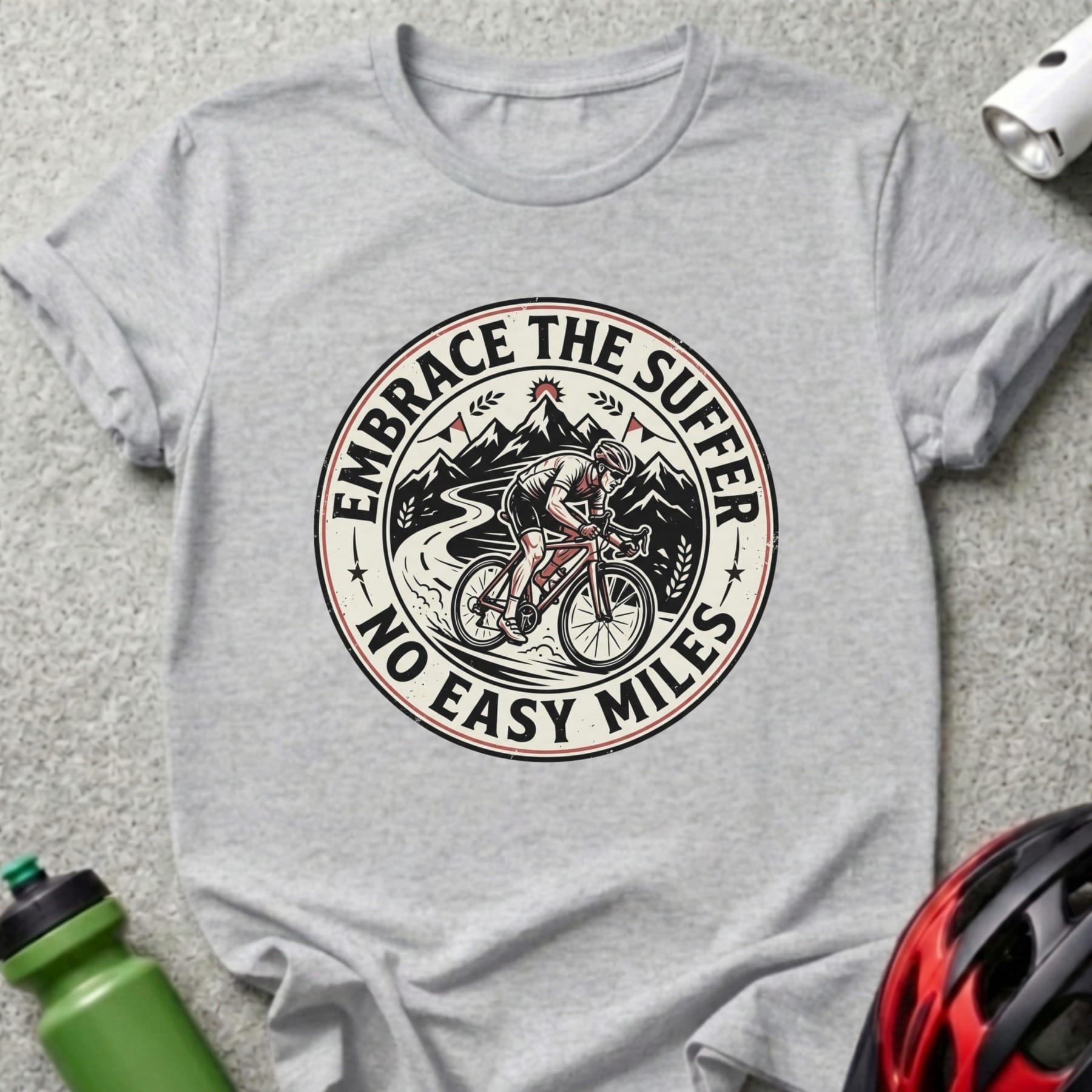 T-shirt with cyclist graphic and text "EMBRACE THE SUFFER NO EASY MILES".