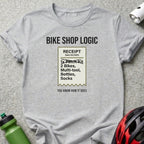 T-shirt with "Bike Shop Logic" receipt listing items and humor.