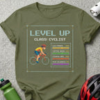 T-shirt with pixelated cyclist and text "LEVEL UP CLASS: CYCLIST" and stats.