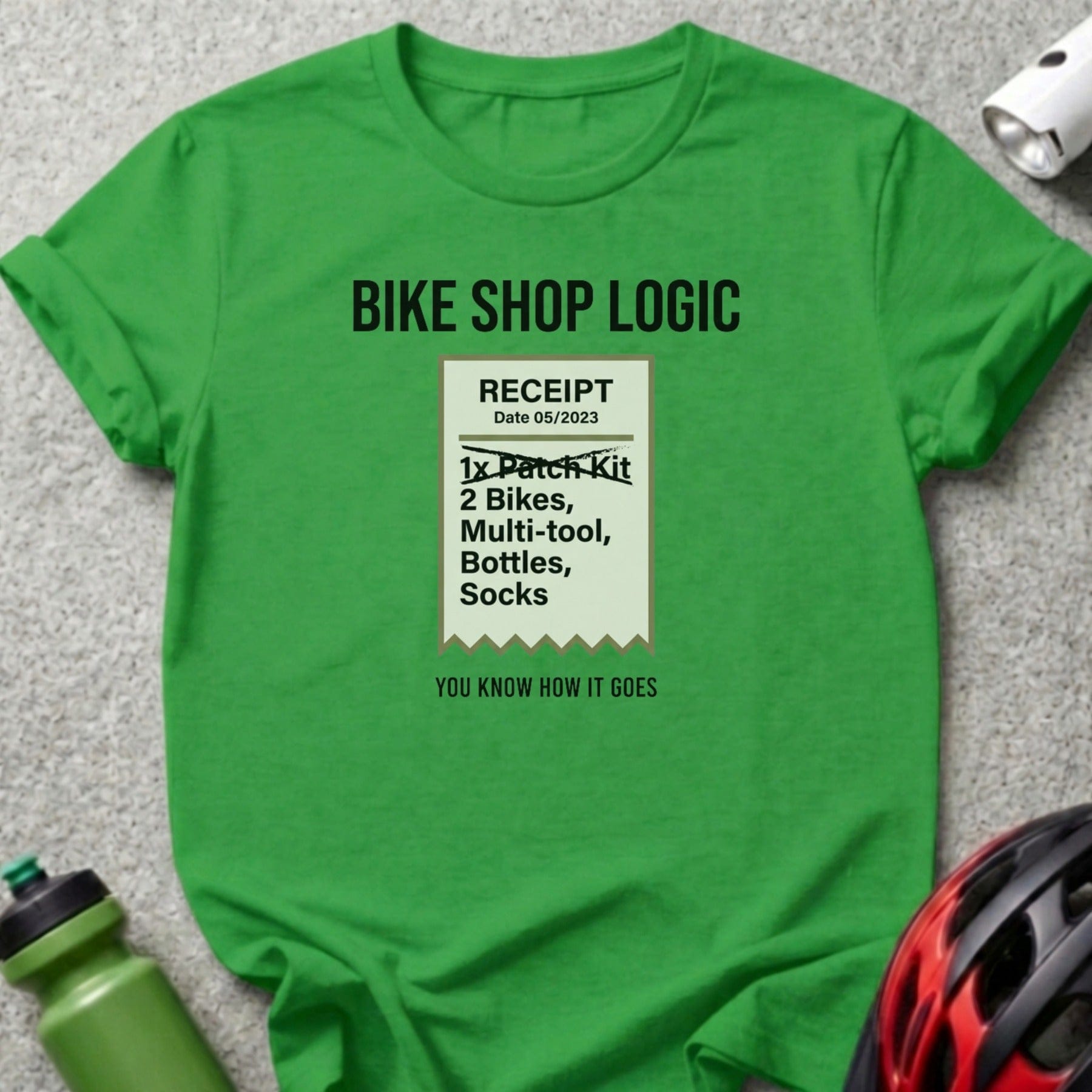 Green t-shirt with "BIKE SHOP LOGIC" receipt graphic listing cycling items.